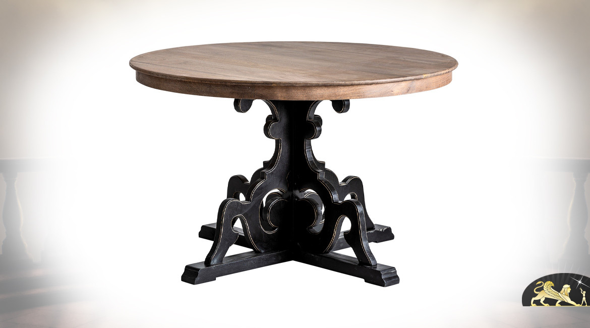 Table ronde en bois de manguier, pieds sculptés de formes baroques finition charbon vieilli, plateau brut, Ø122cm