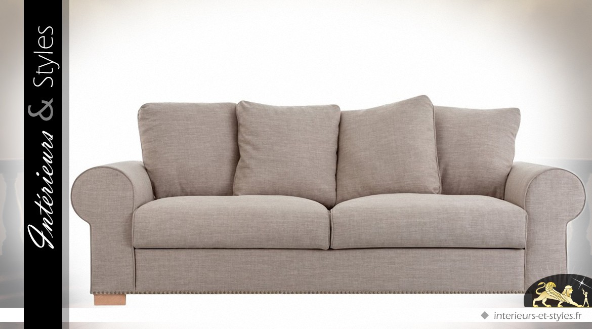 Canapé 3 places recouvert toile grise avec dossier en coussins