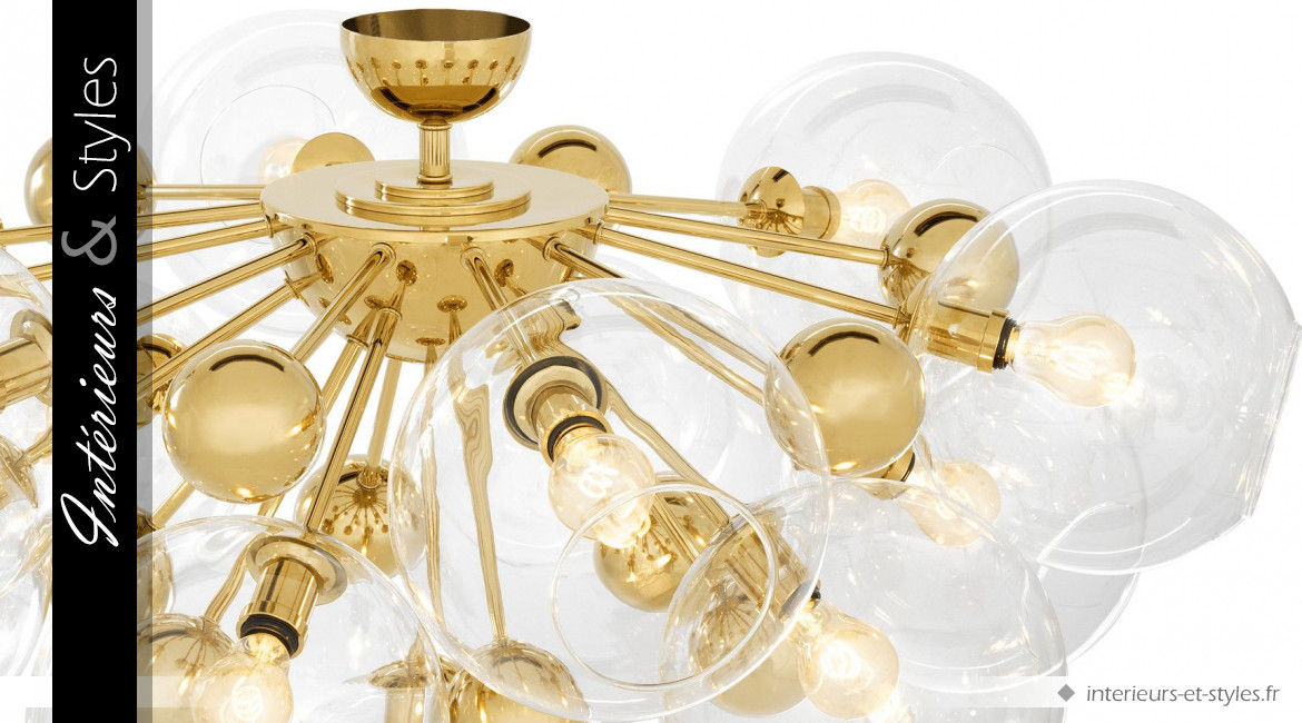 Plafonnier design Soleil signé Eichholtz,  en métal finition dorée et 13 globes de verre